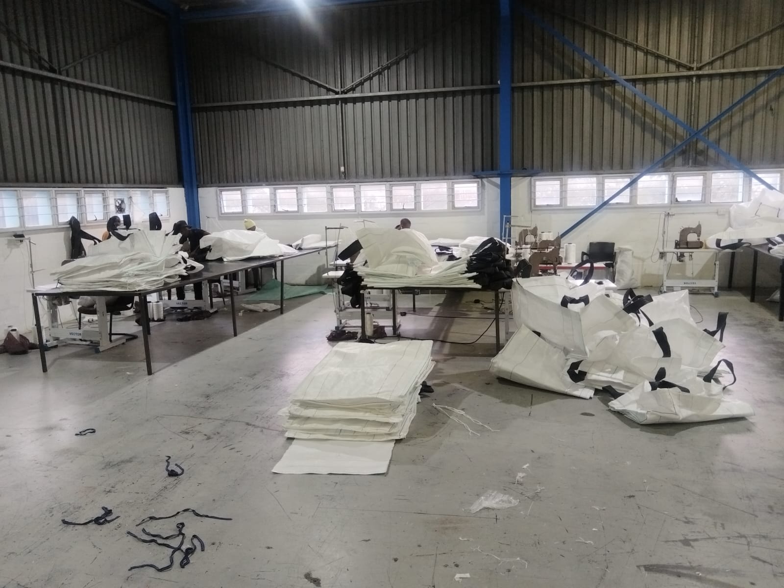Mining site where chemical-resistant woven bags transport ore and waste